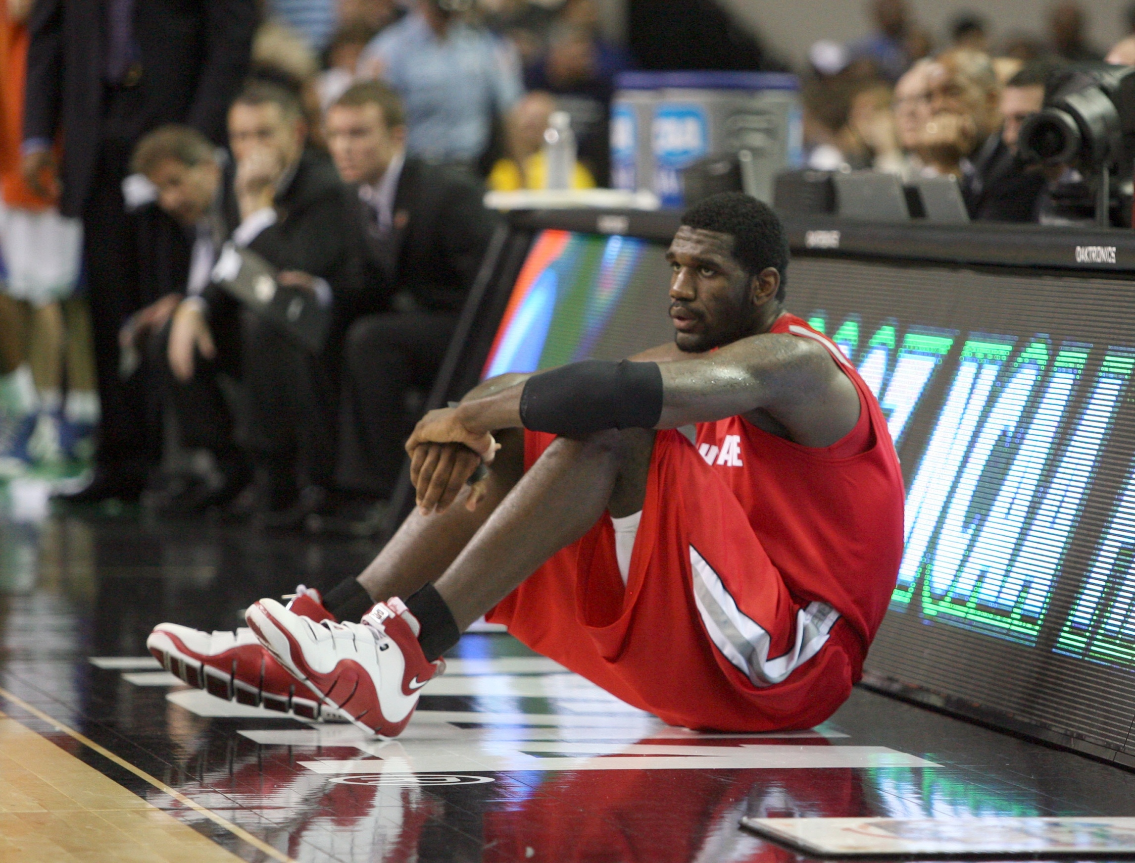 Ohio State's Greg Oden reacts to the crowd before an interview